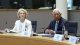 Two officials sit at a conference table with microphones and documents; the nameplate reads António Costa in front of them.