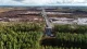 Aerial view of cleared forest land next to intact woodland in Finland