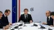 French President Emmanuel Macron sitting at a cabinet meeting table
