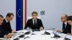 French President Emmanuel Macron sitting at a cabinet meeting table