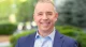 A Waters Corporation executive smiling outdoors