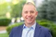 A Waters Corporation executive smiling outdoors